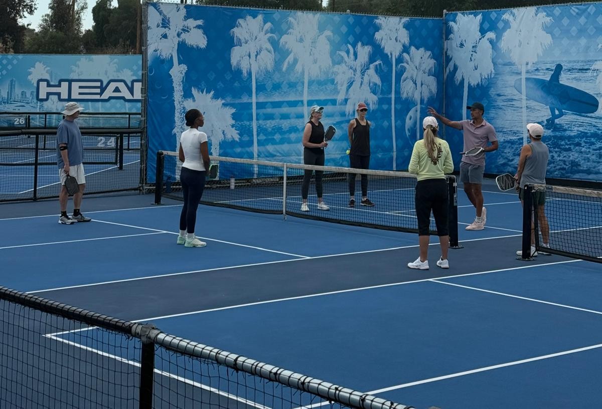Coach guiding players during practice